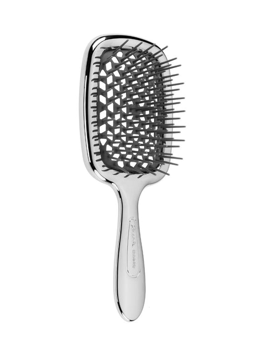 Chrome Janeke hairbrush with geometric pattern on a white background