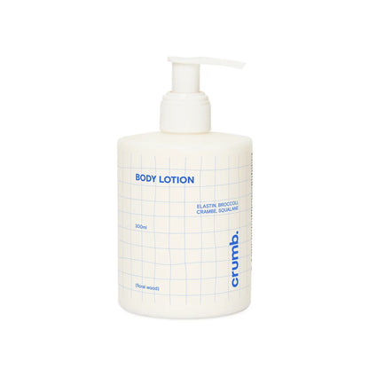 Crumb Body Lotion Floral Wood bottle with pump labeled on a white backgroud
