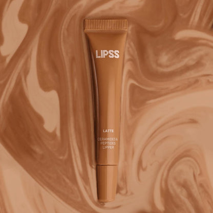 LIPSS lip gloss tube on a swirled brown background