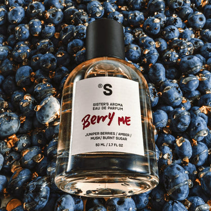 Sister's Aroma Perfume "Berry Me" surrounded by blueberries