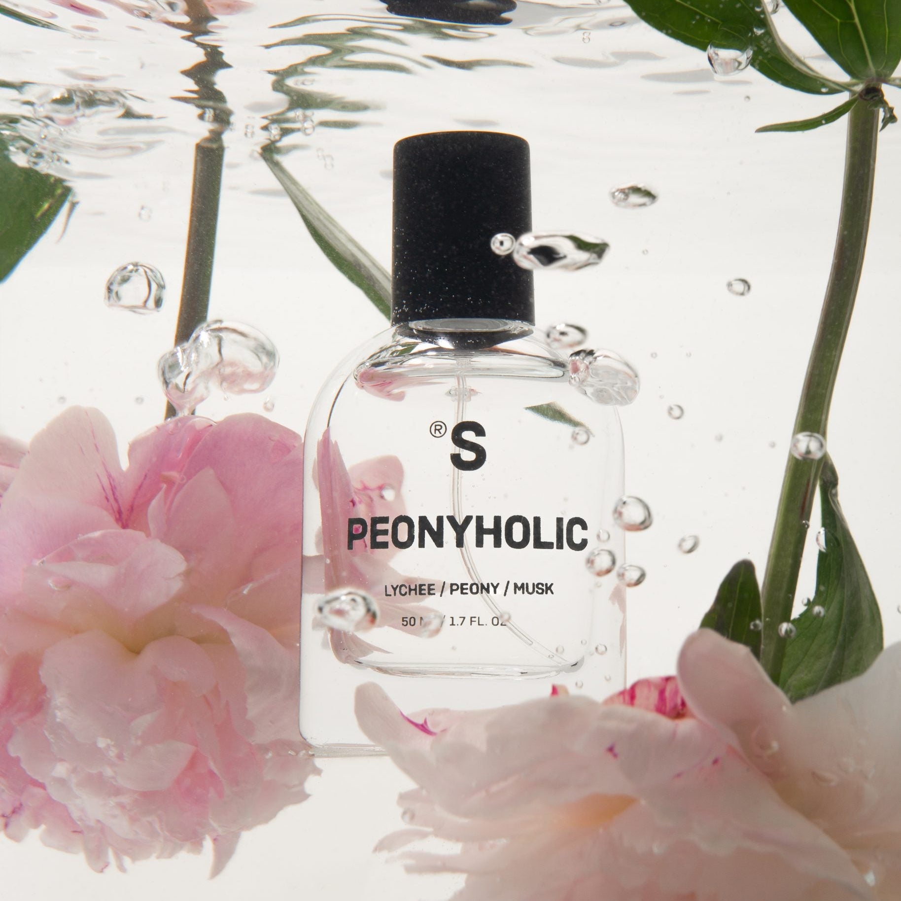 Sister's Aroma Perfume 'Peonyholic' surrounded by pink peonies and water droplets.