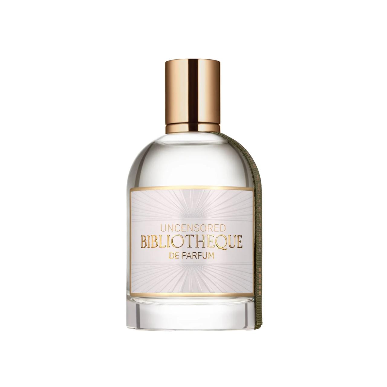 Perfume bottle with gold cap and label Bibliotheque de Parfum Uncensored on a white background