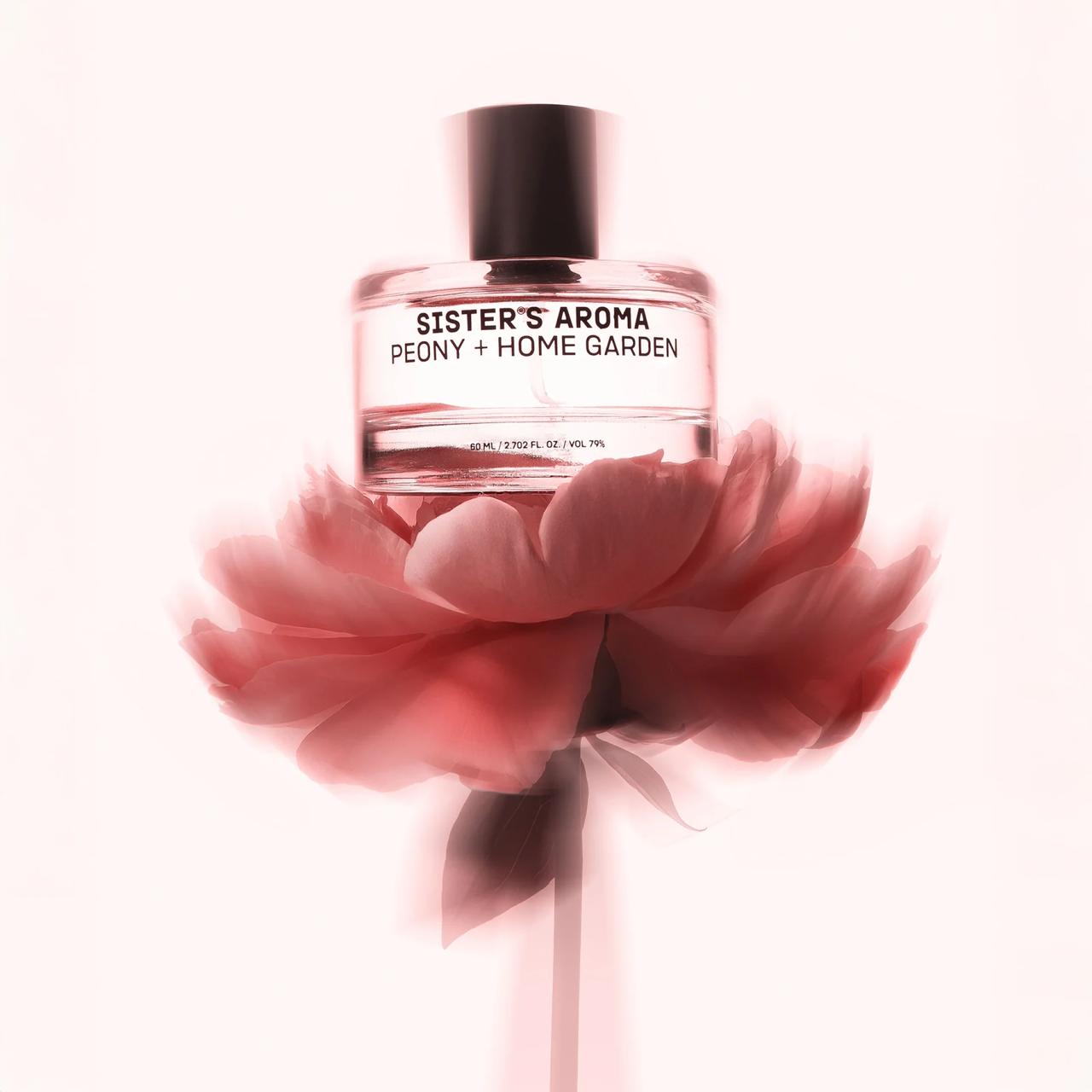 Car perfume Sister's Aroma Peony + Home Garden with a peony in the foreground on a white background