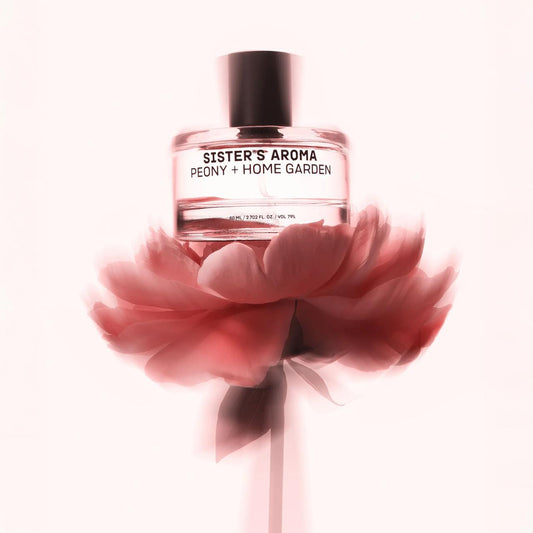 Car perfume Sister's Aroma Peony + Home Garden with a peony in the foreground on a white background