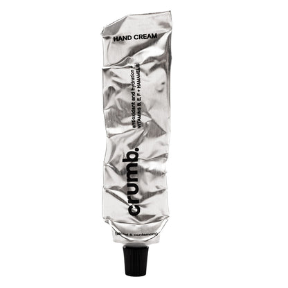 crumb silver tube of hand cream santal & cardamon on a white background