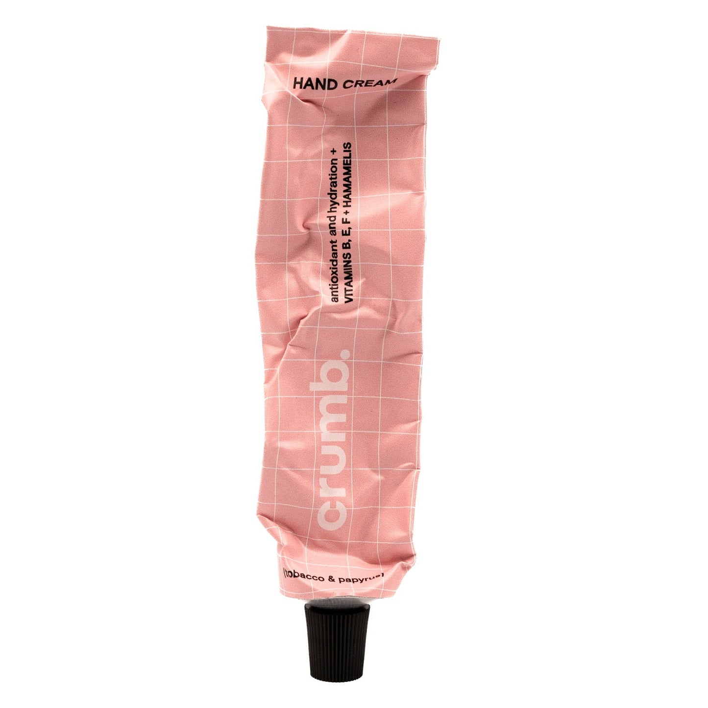 crumb pink hand cream tube tabacco & papyrus on a white background