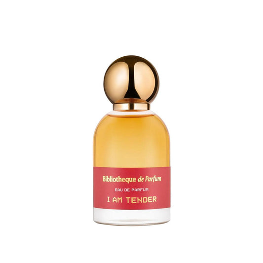 Perfume bottle with gold cap and red label  Bibliotheque de Parfum I an tender on a white backgrounde